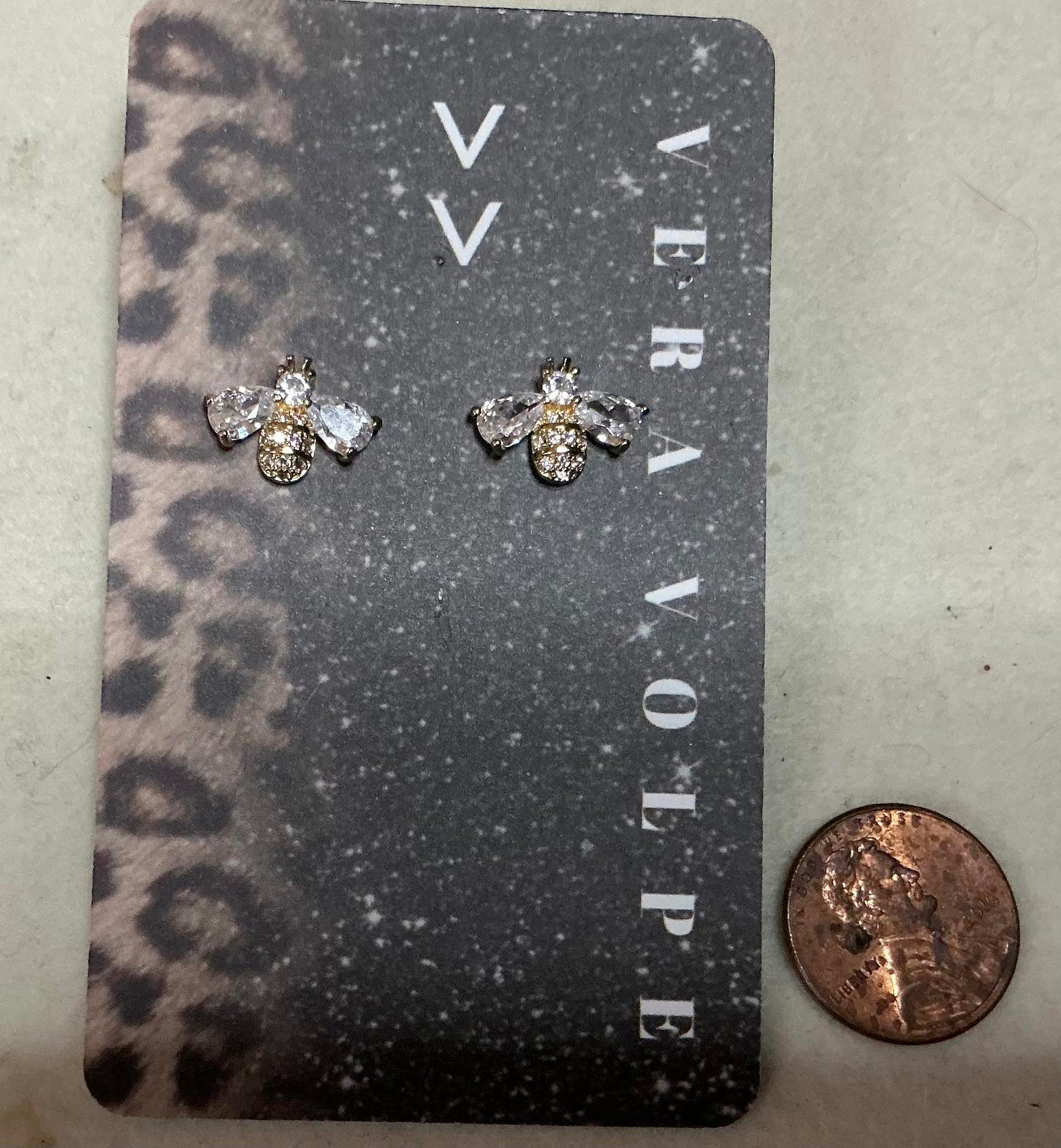 ^ Buzz By Earrings
